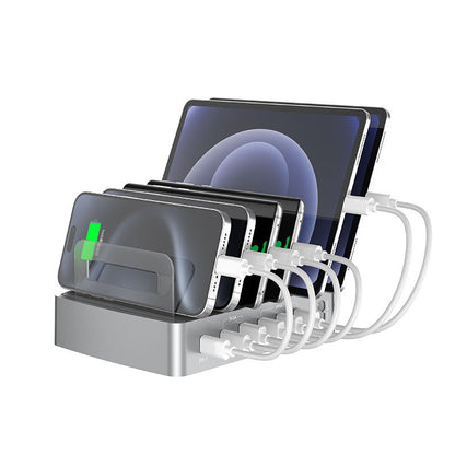 Intelligente Desktop-Ladestation zum gleichzeitigen Laden mehrerer Geräte wie Smartphone, Tablet und Kopfhörer. Mit QC3.0 und PD Schnellladen sorgt sie für effizientes Aufladen, während der integrierte Gerätehalter für Ordnung und Komfort am Schreibtisch sorgt. Reduziert Kabelsalat und ist ideal für Homeoffice, Büro oder Zuhause.