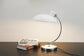 Moderne Tischlampe im Bauhaus- und Nordic-Design – stilvolles Licht für dein Home Office
Diese elegante Tischlampe vereint zeitloses Design mit praktischer Funktionalität. Die verstellbare Lichtausrichtung sorgt für optimalen Komfort beim Arbeiten, während das minimalistische Design jeden Raum optisch aufwertet. Perfekt für ein modernes und gemütliches Home Office
